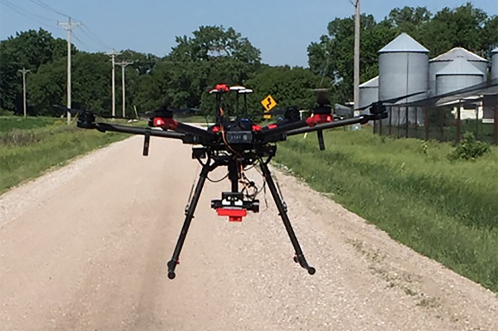 The drone takes off with the landing gear down.