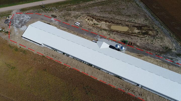 An aerial view of a commercial operation. The dotted line indicates the perimeter buffer area (PBA).